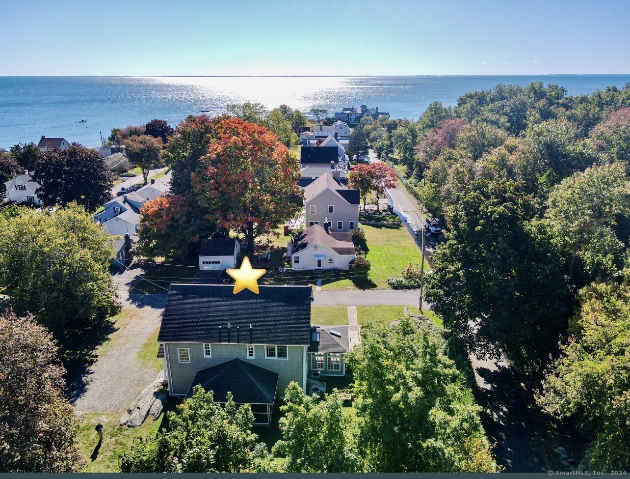 an aerial view of house with yard swimming pool and outdoor seating