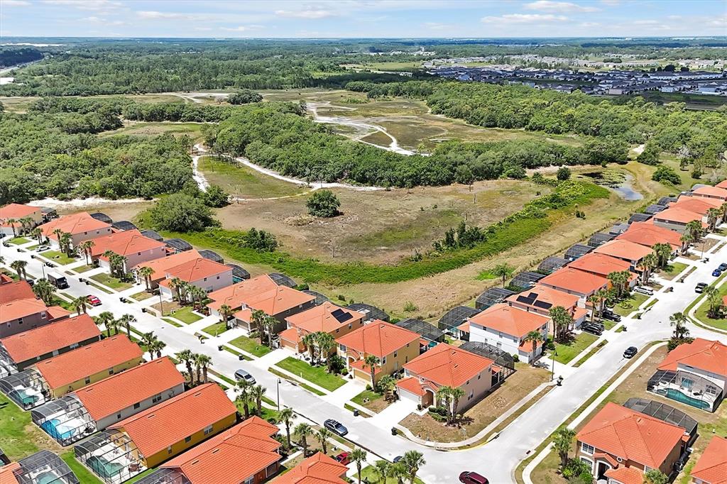 an aerial view of residential houses with outdoor space