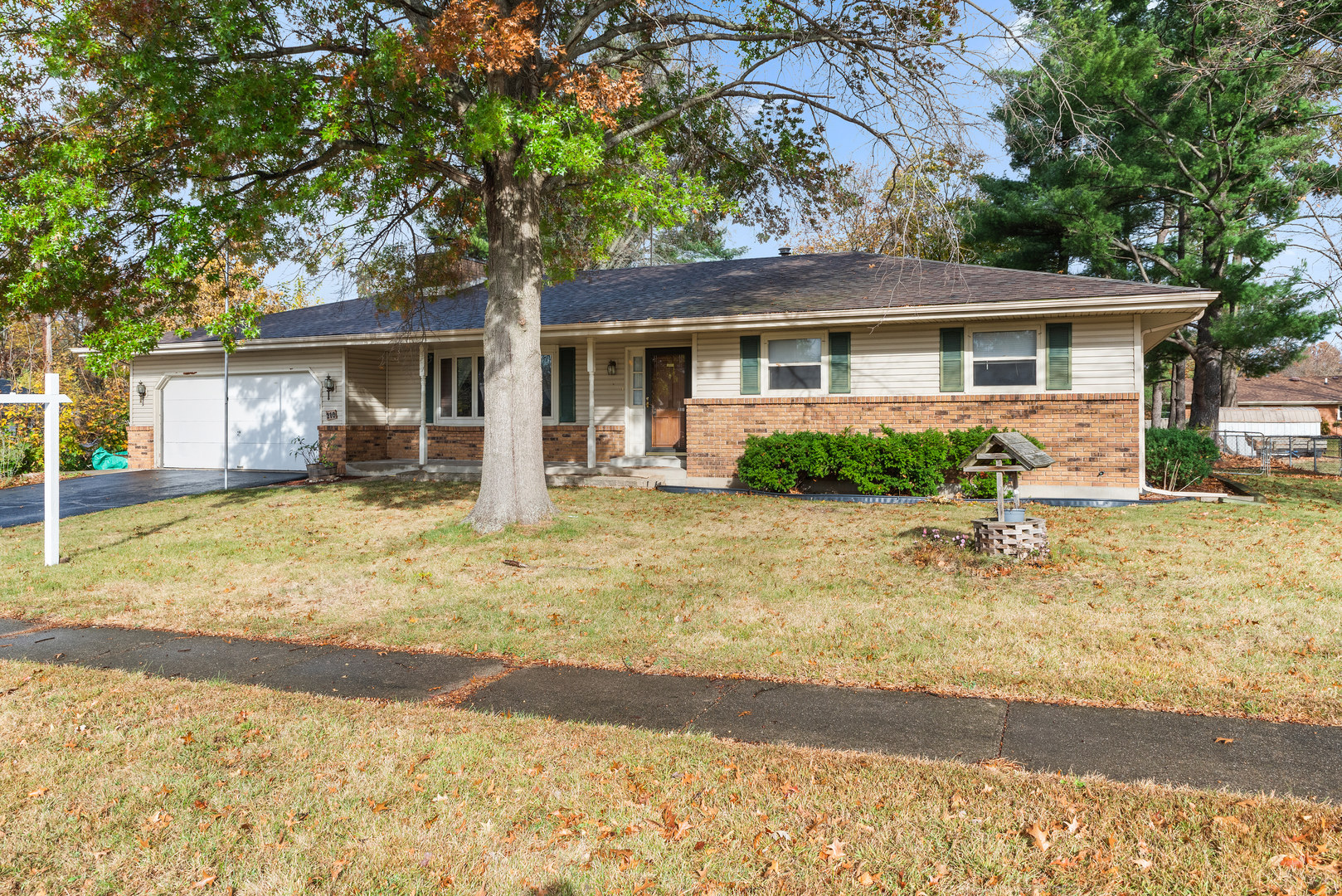 front view of a house with a yard