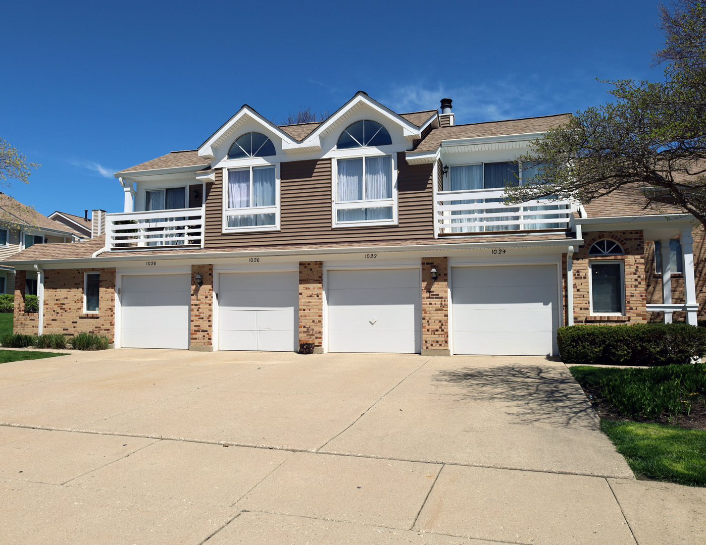 a front view of a house with yard