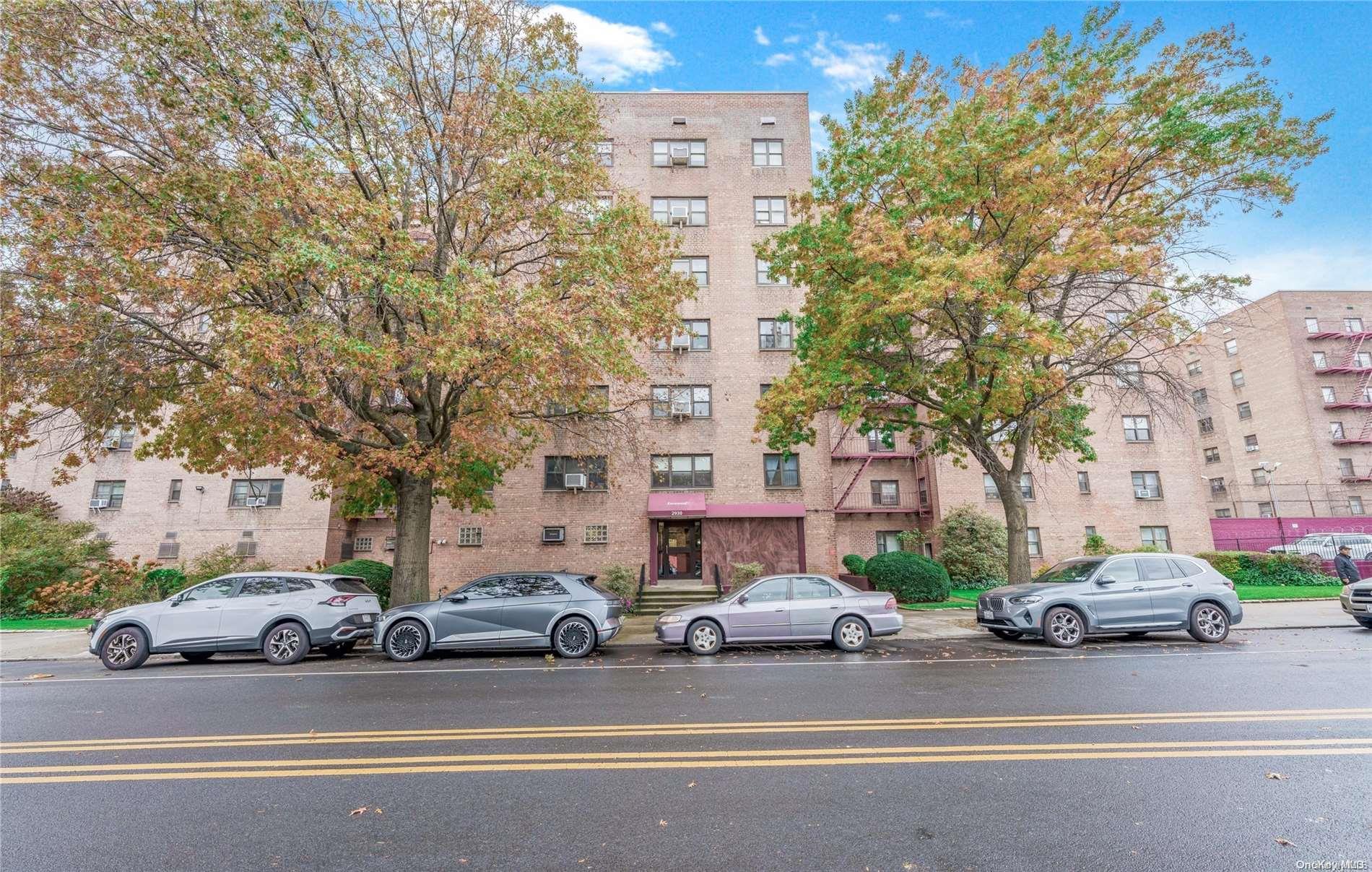 a view of a cars parked in front of a building