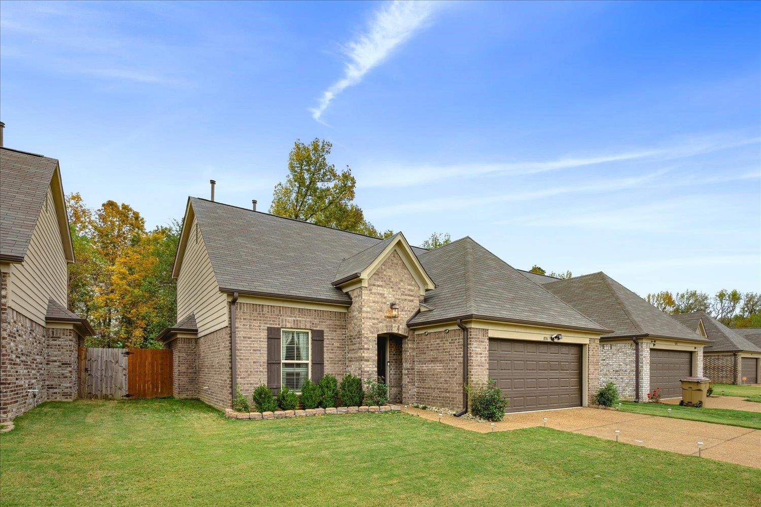 front view of a house and a yard