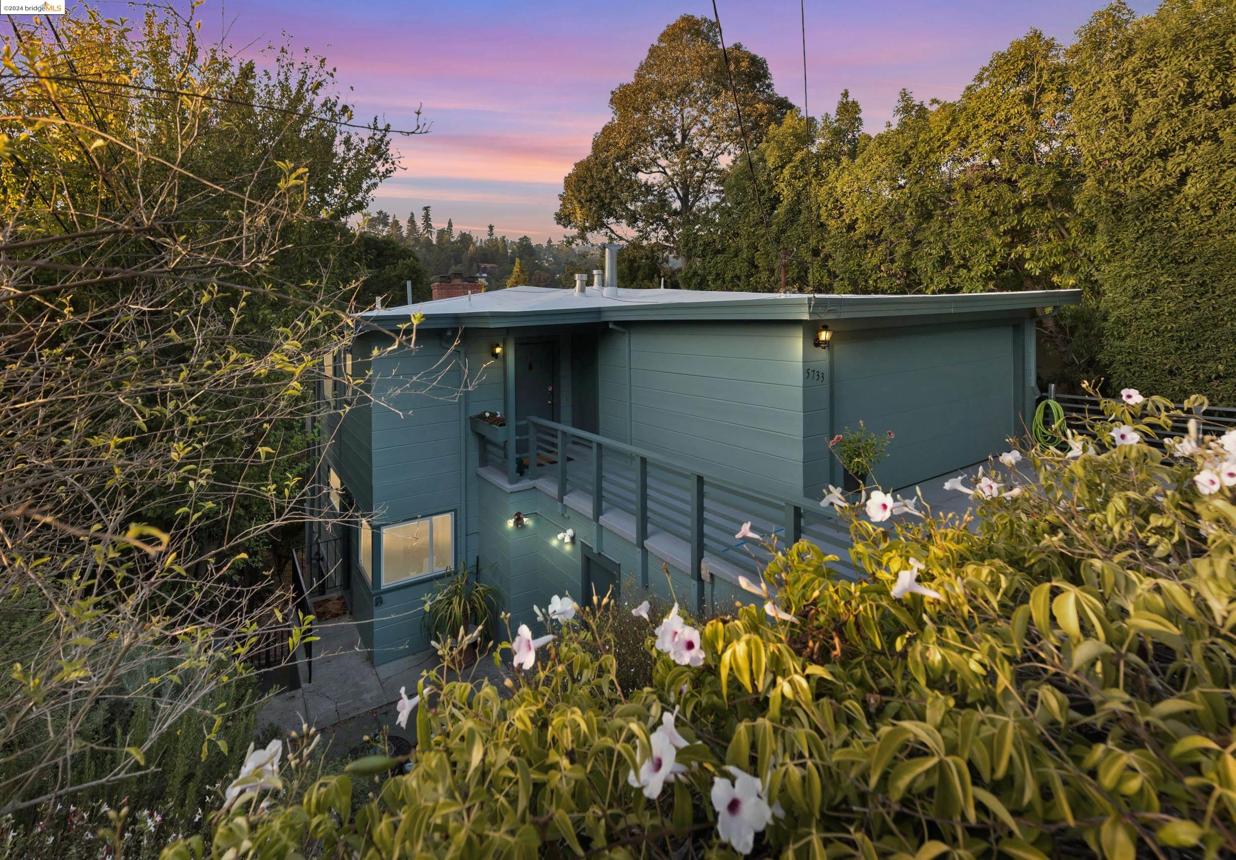 a backyard of a house with lots of green space