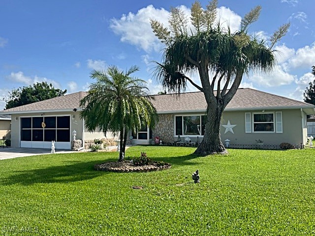 a front view of house with yard and green space