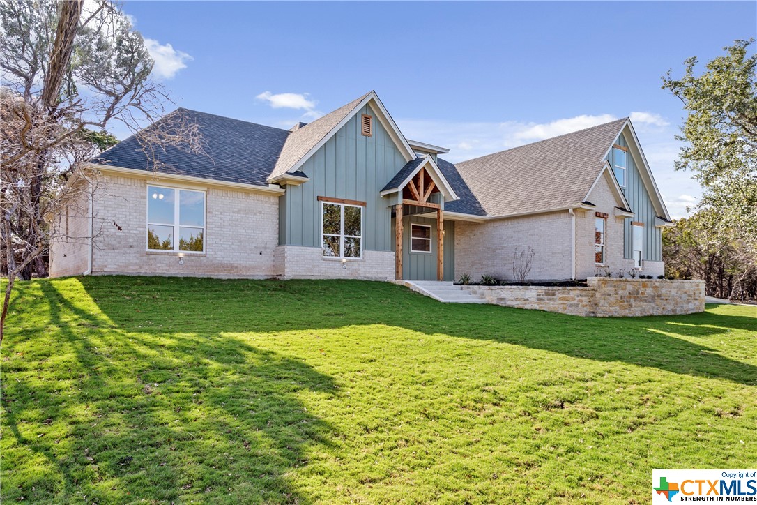 front view of a house with a yard