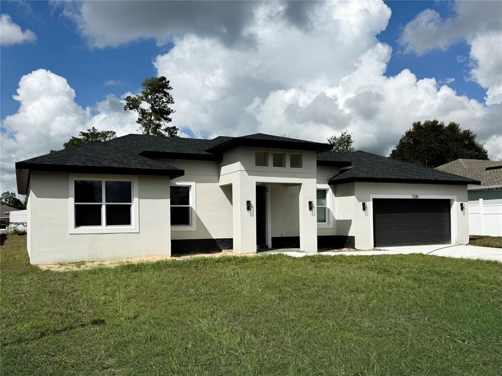 a front view of a house with a yard