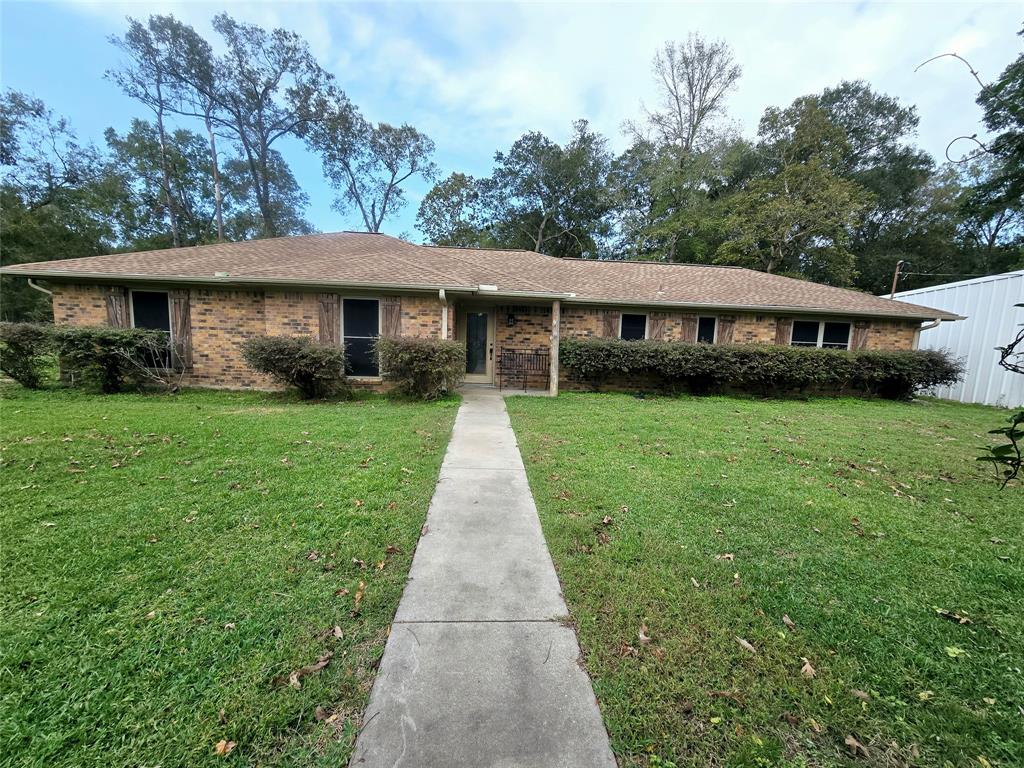 a front view of a house with yard