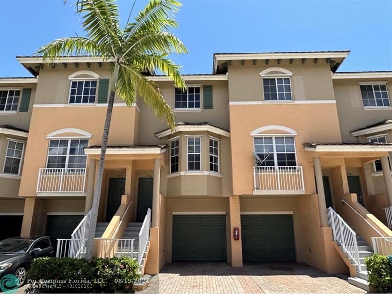 Tri Level Townhouse with 1 Car Garage + 1 Driveway Parking