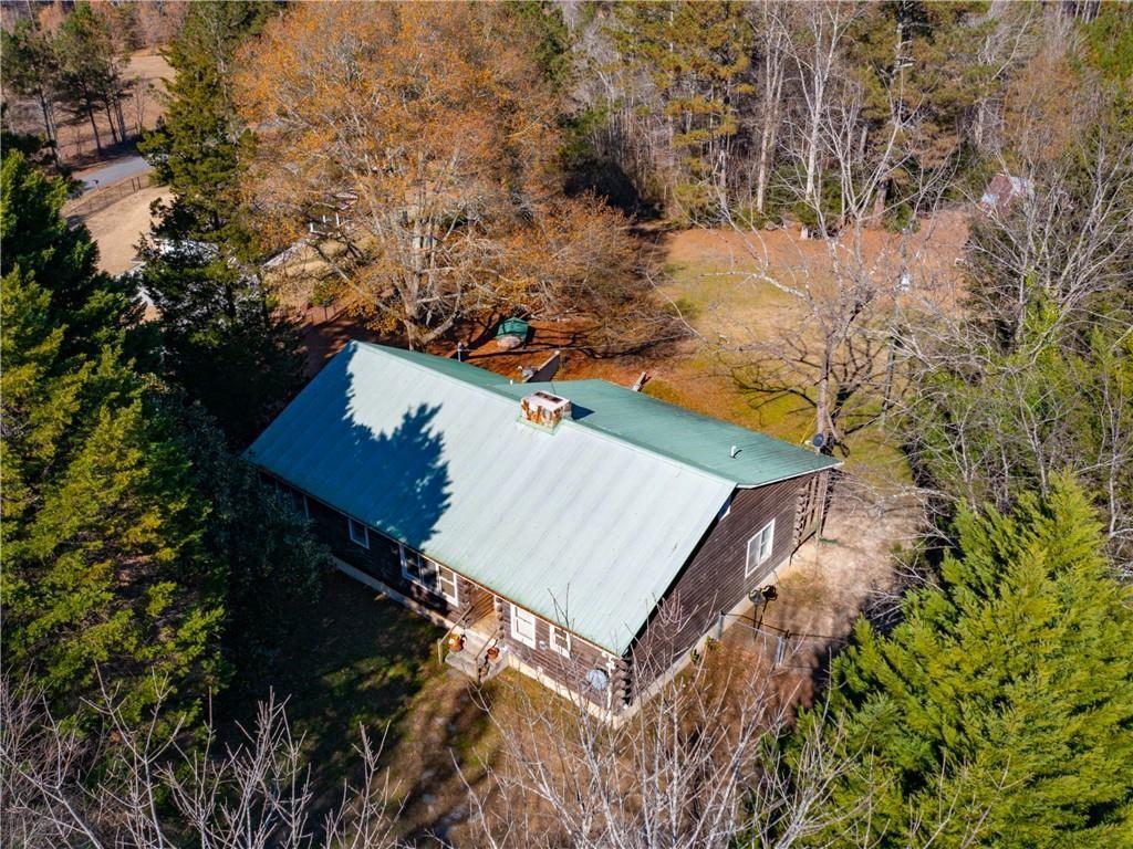 an aerial view of a house with yard