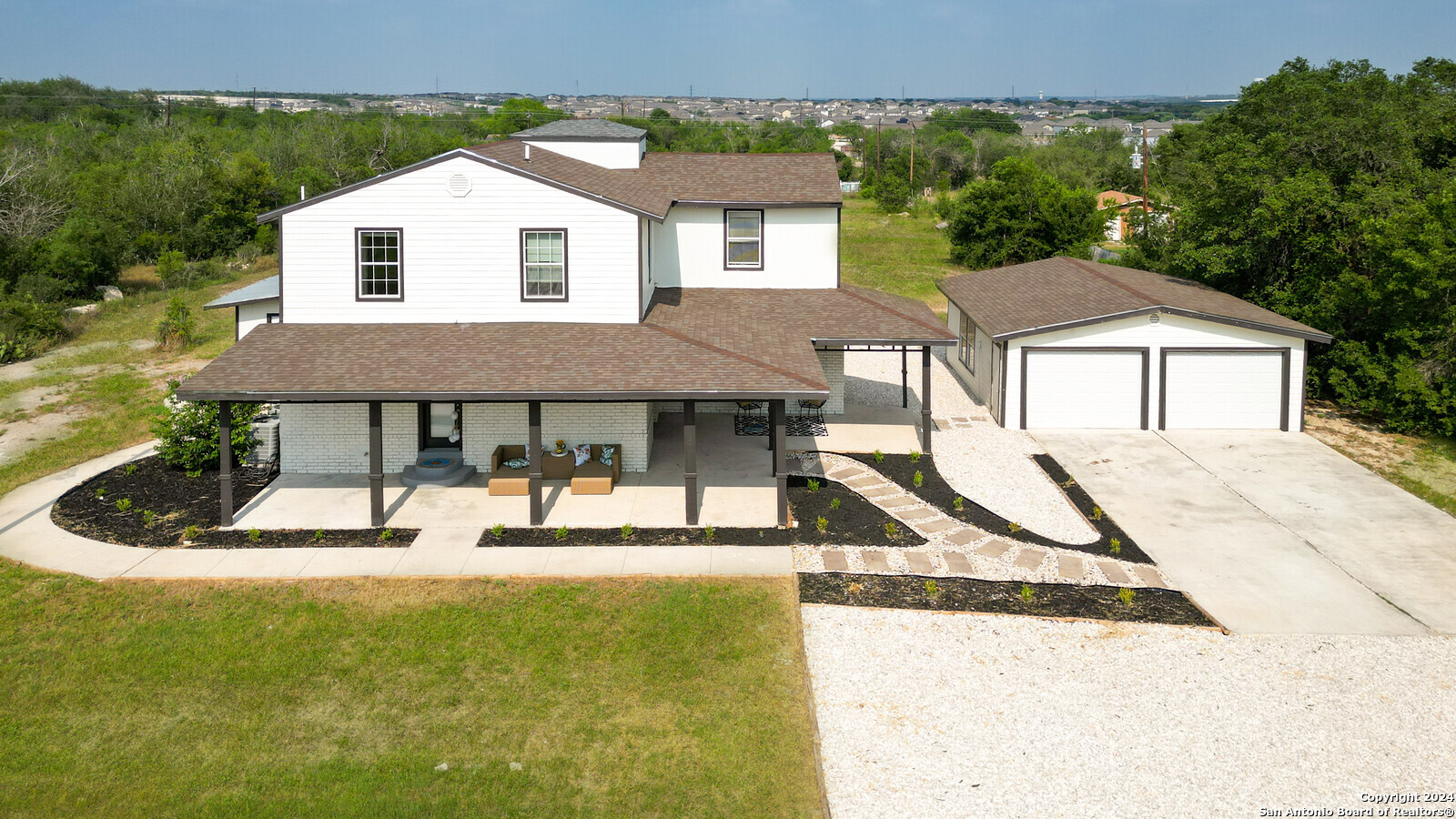 a house view with a backyard space