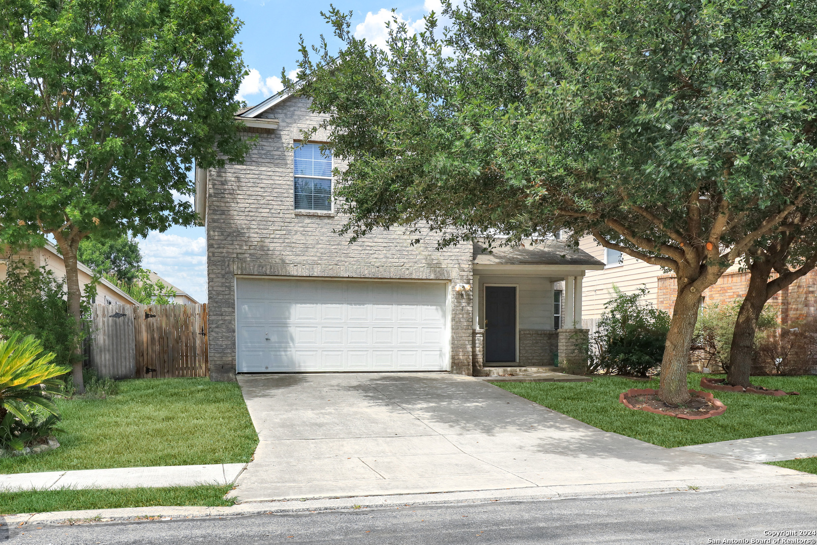 front view of a house with a yard