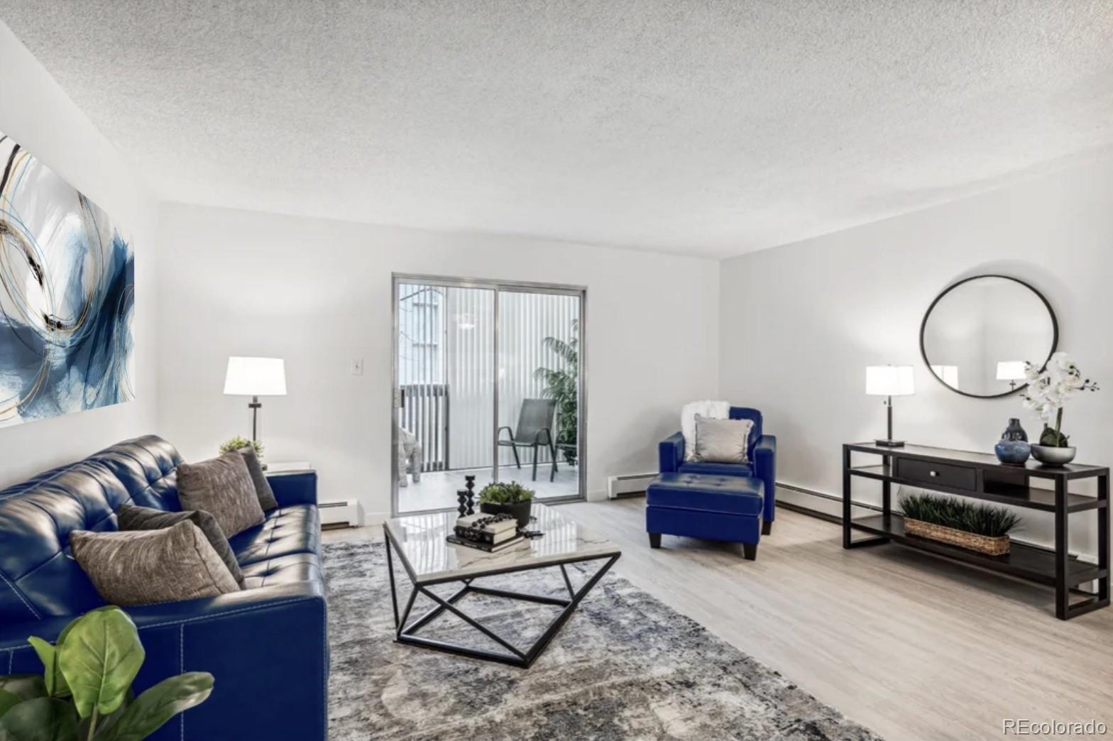 a living room with furniture a mirror and a window