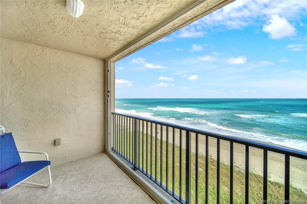 a view of a balcony with an ocean view