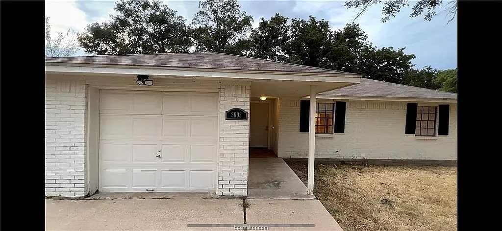 Ranch-style home featuring a garage