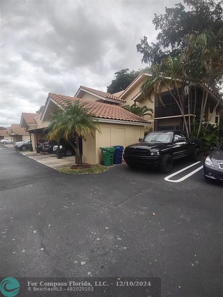 a side view of a car with garage