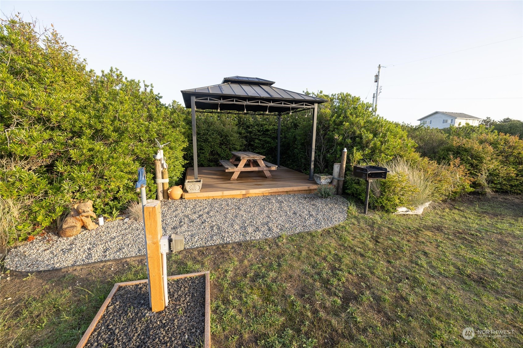 a view of a backyard with sitting area