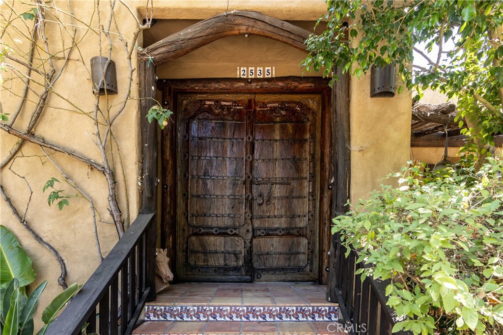 a view of a wooden door of the house