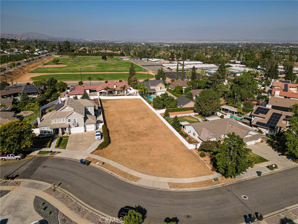 an aerial view of a house with a lake view