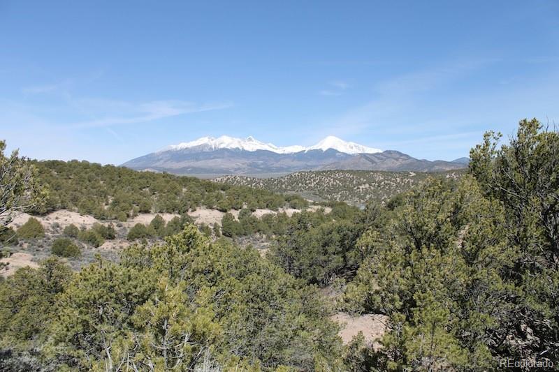 a view of a town with mountains in the background