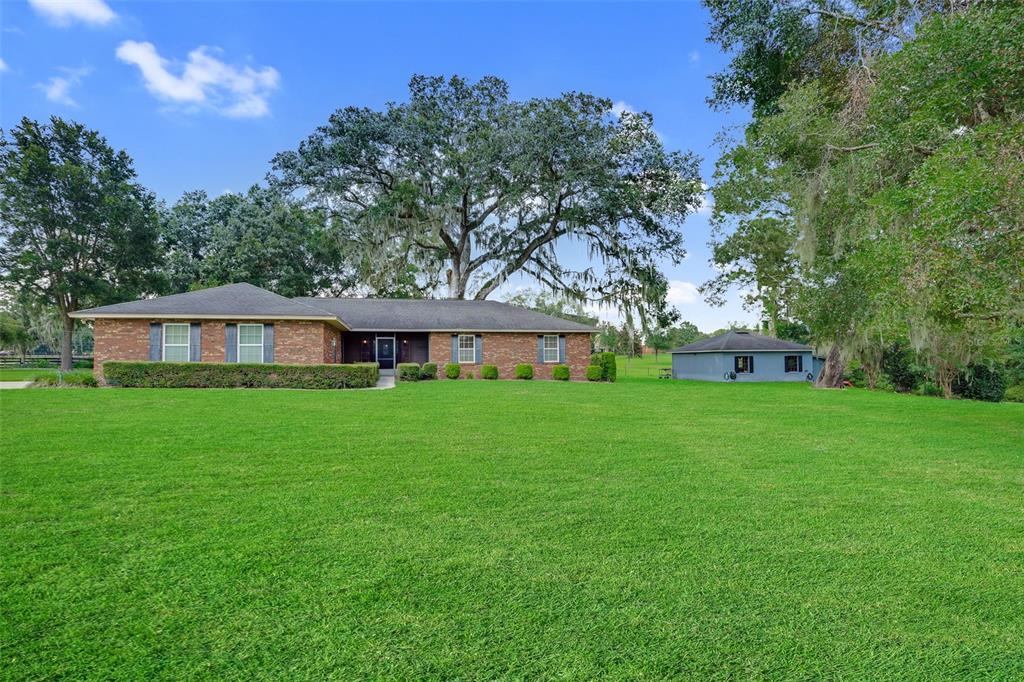 a view of a house with a yard