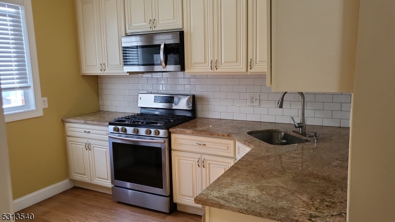 a kitchen with a stove and a microwave