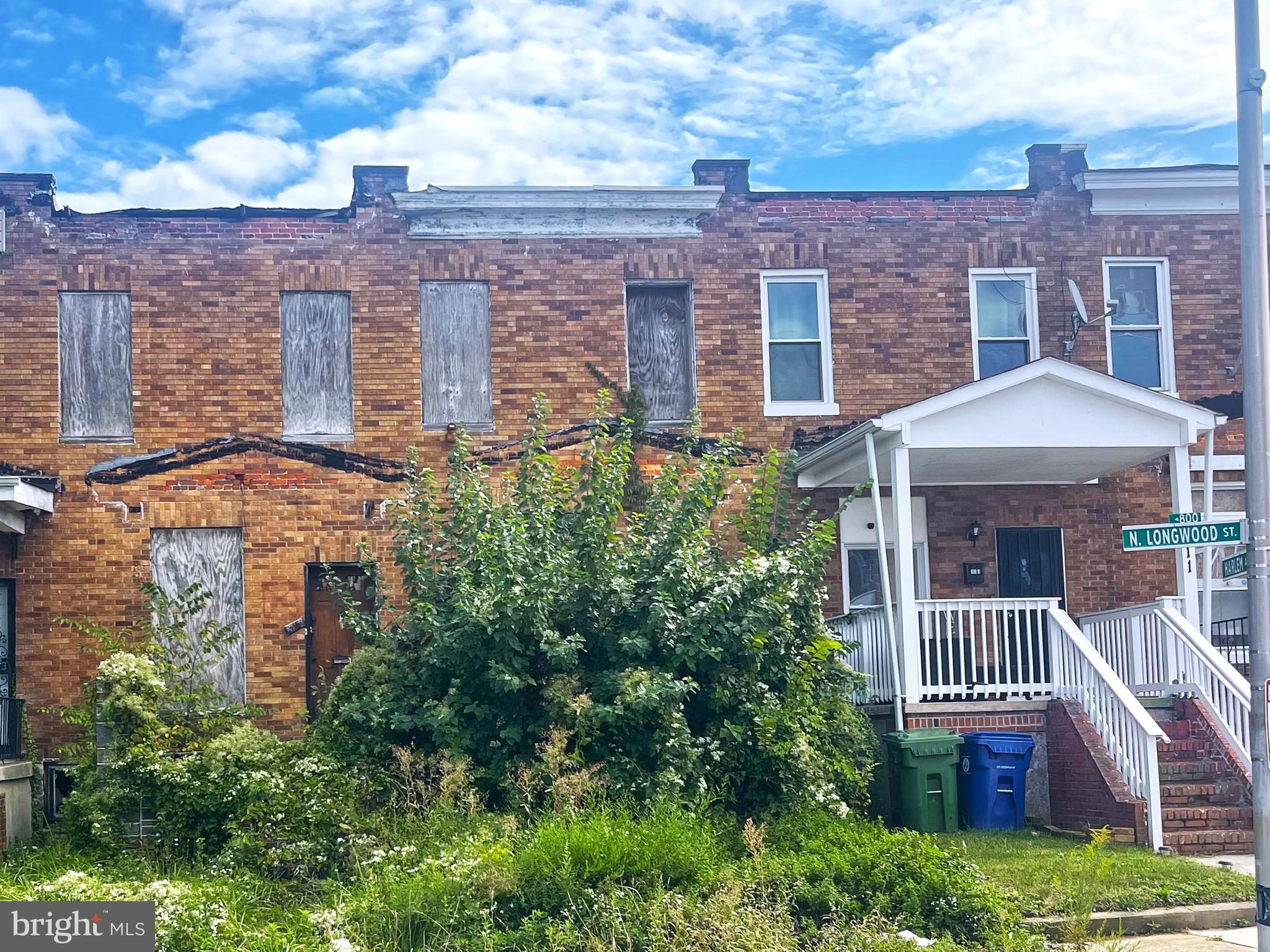 front view of a house with a small yard