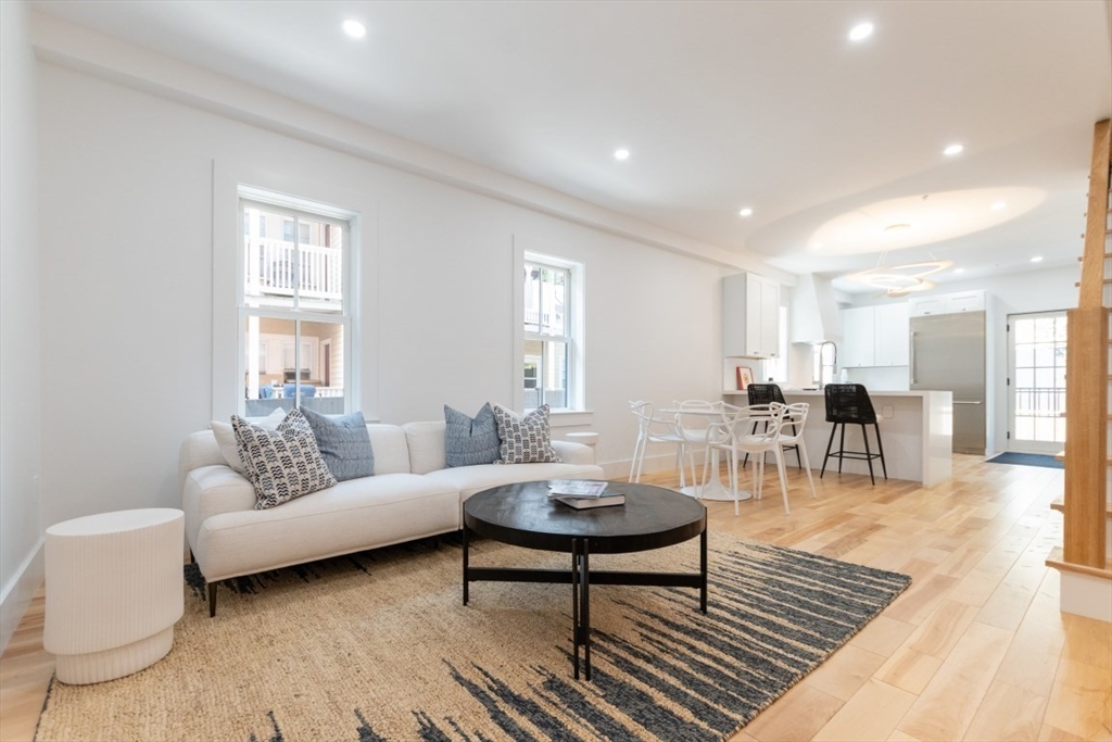 a living room with furniture and a table