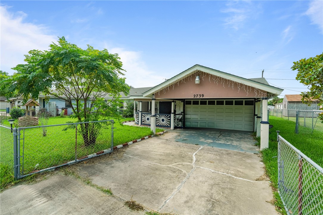 a front view of a house with garage