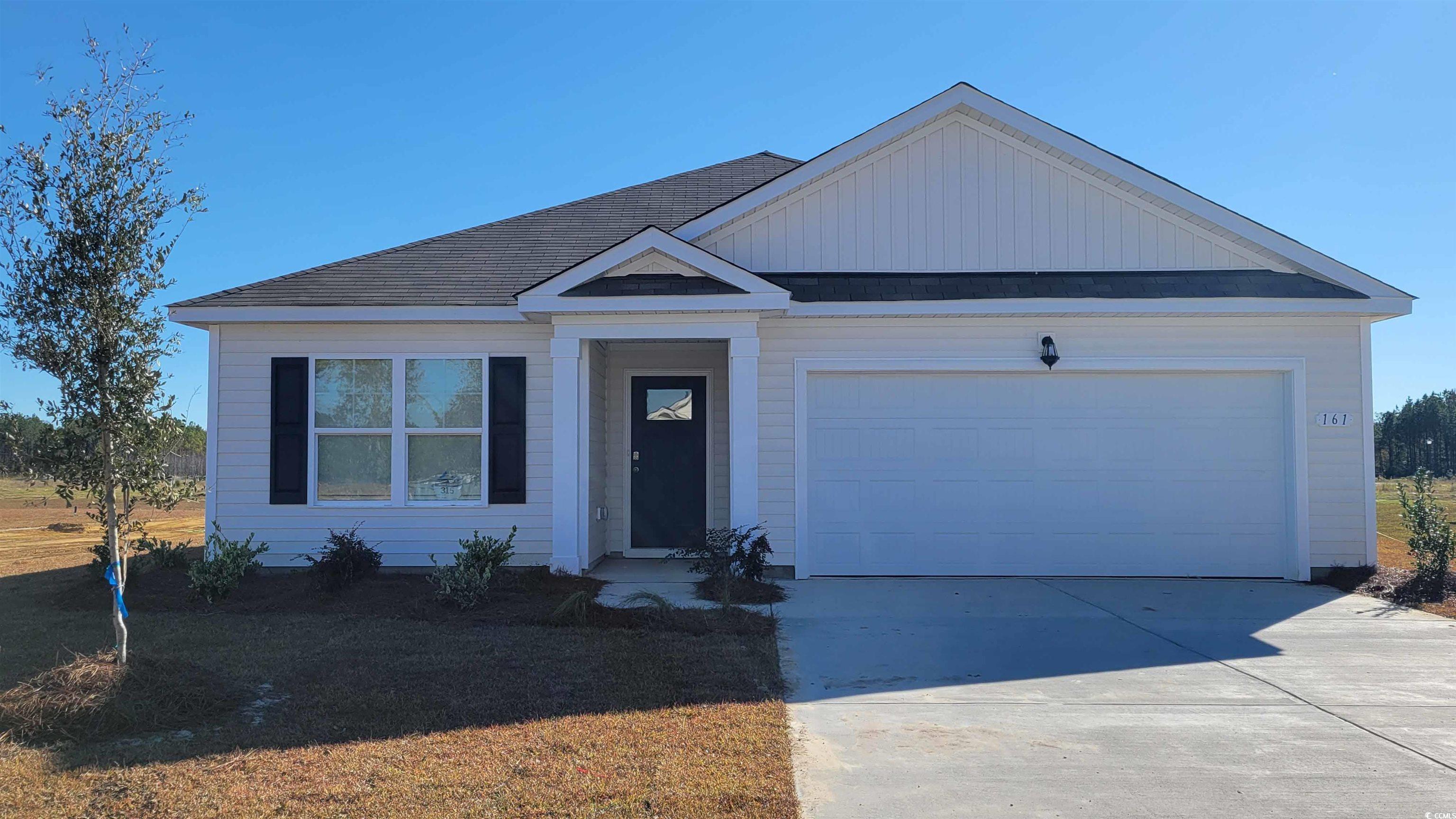 View of front facade with a garage