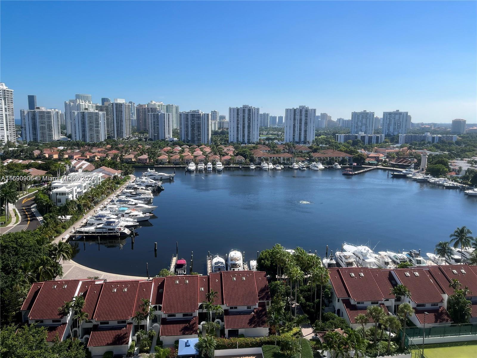 an aerial view of a city with lake