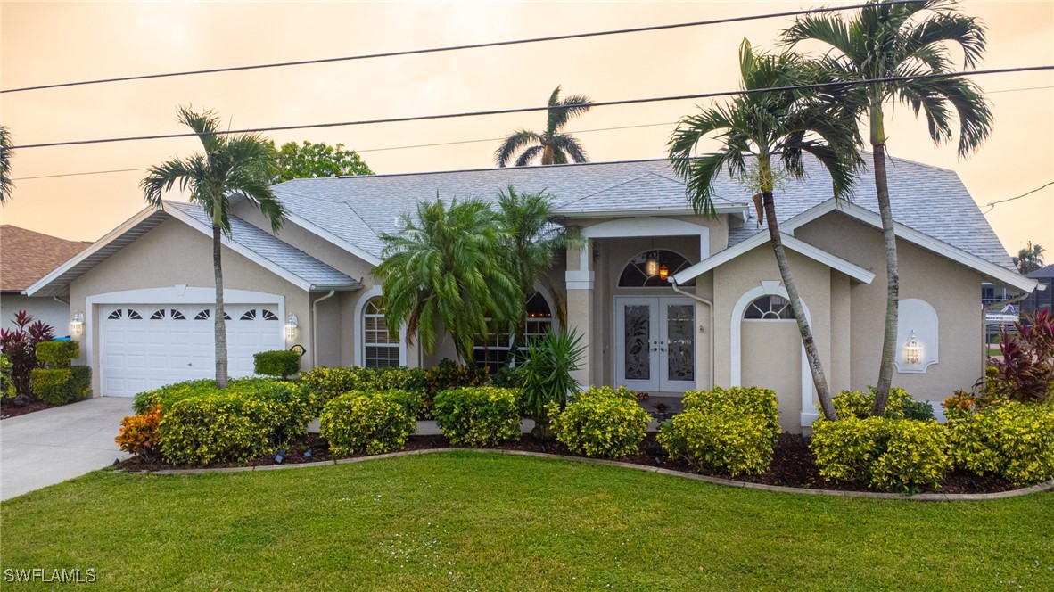 a front view of a house with a garden