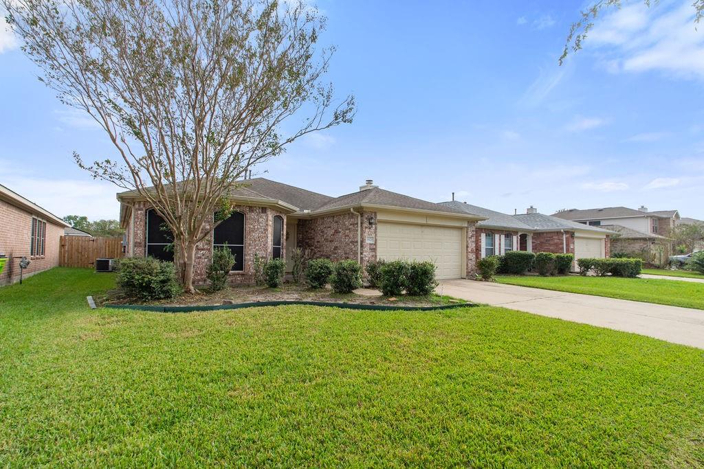 Charming and well-maintained, this lovely one-story home features a classic brick exterior that exudes timeless appeal. The home is complemented by a double attached garage, providing convenience and ample storage space. Large windows throughout the house allow for plenty of natural light, creating a bright and welcoming atmosphere both inside and out.