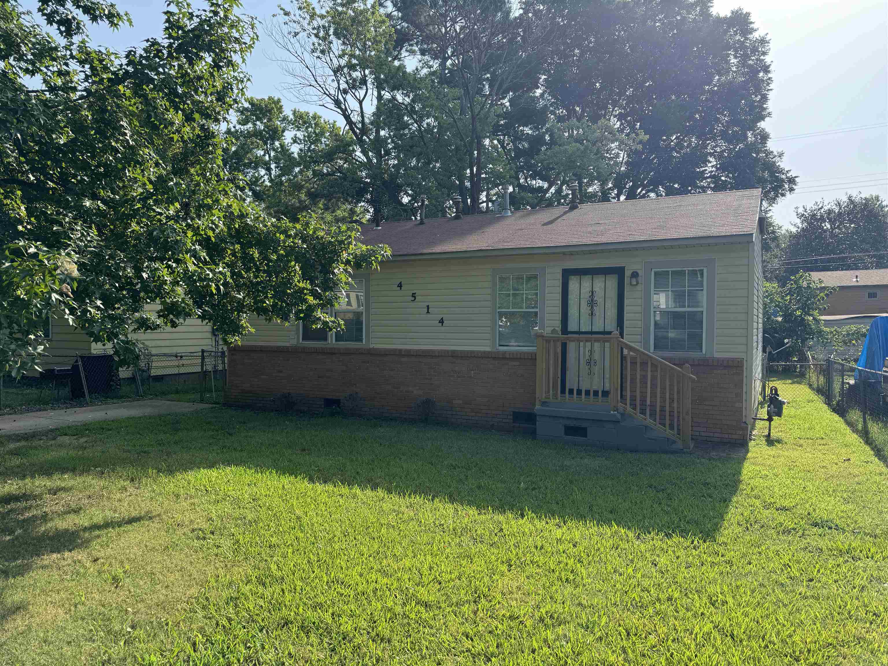 Bungalow-style house featuring a front yard