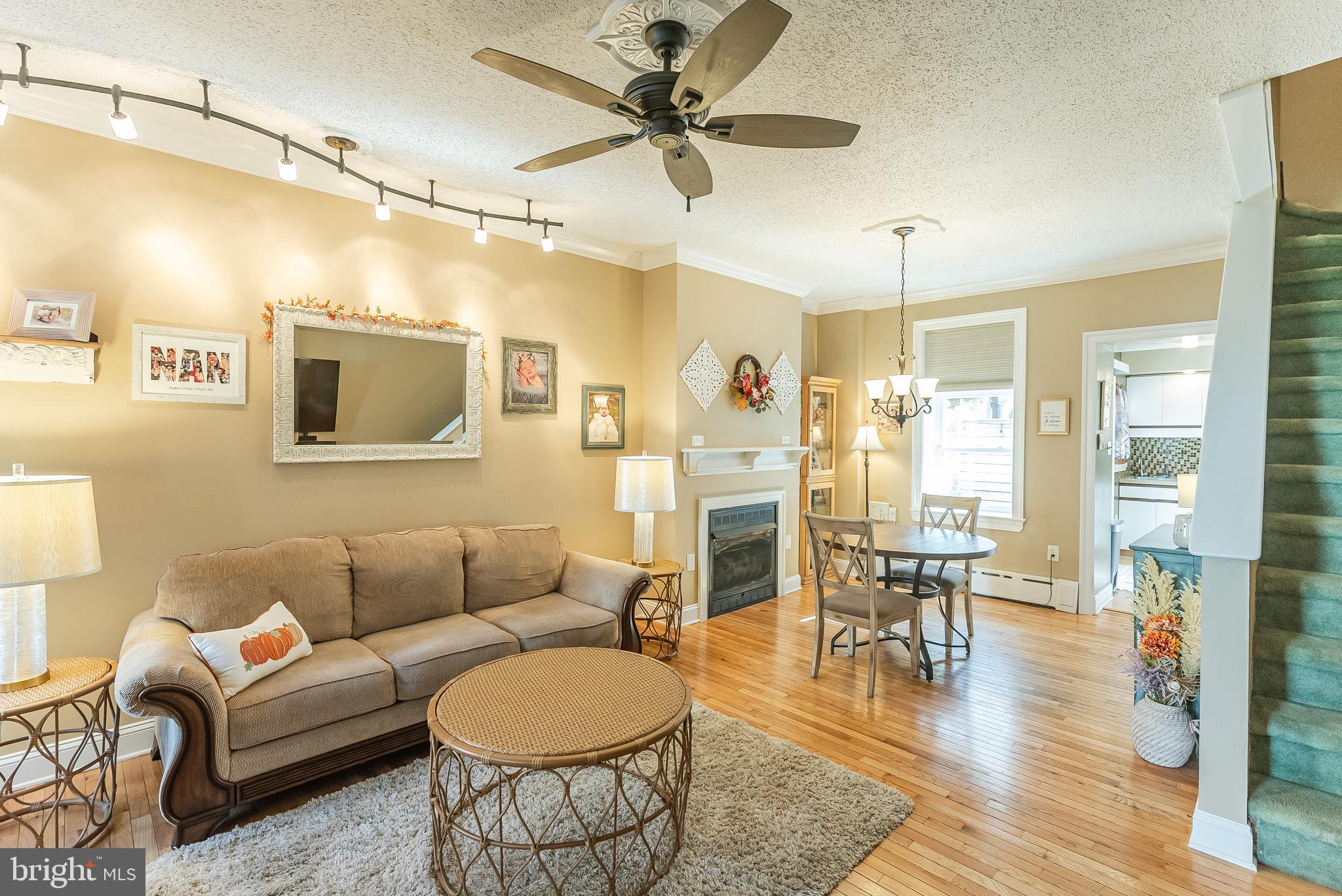 a living room with furniture a dining table and chairs