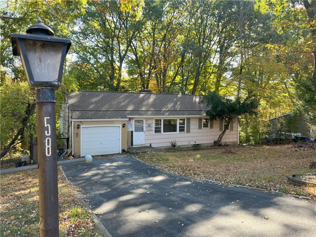 View of front of property featuring a garage