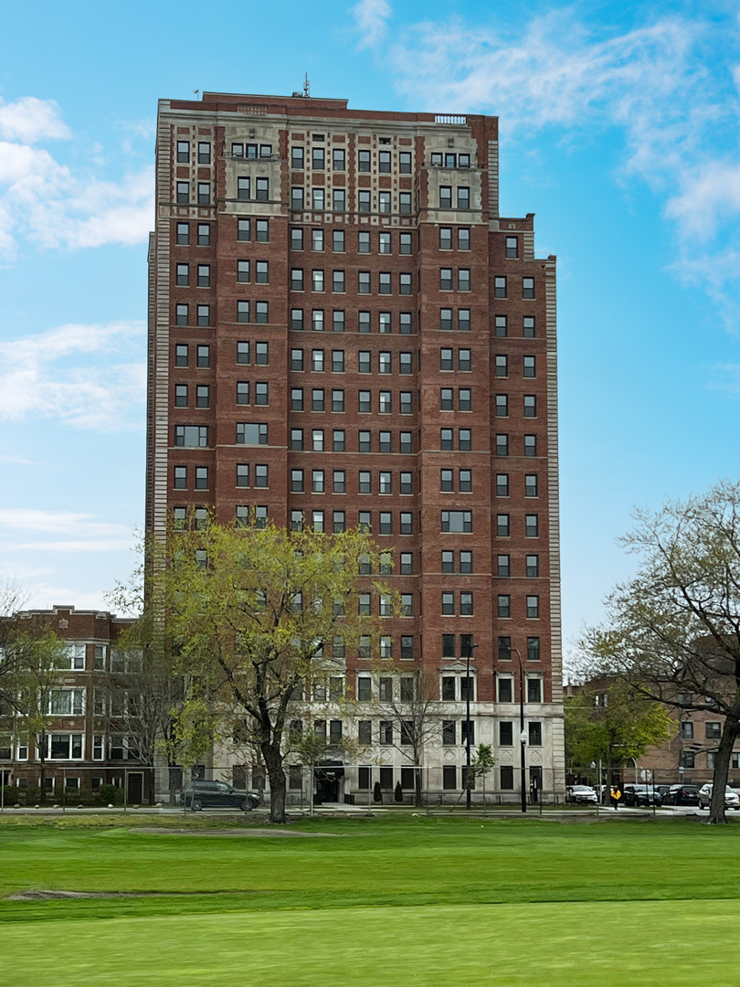 a view of a building with a yard