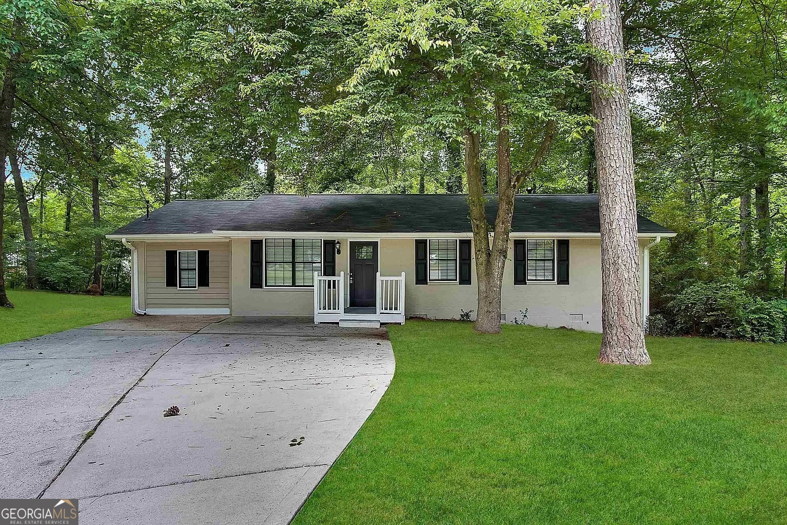 front view of a house with a yard