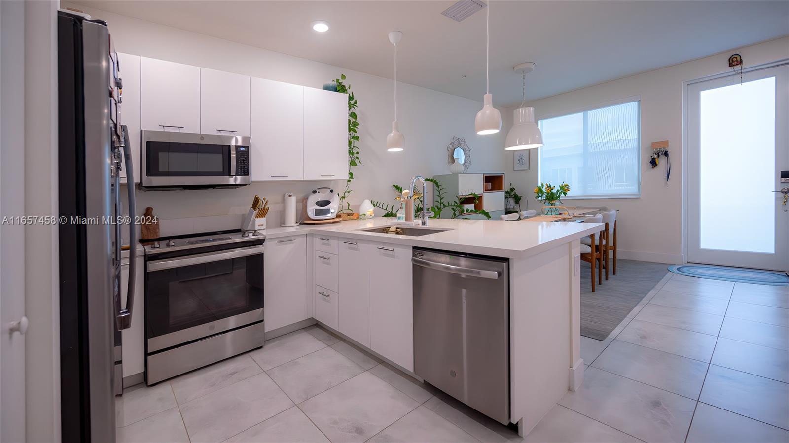 a kitchen with a sink stove and microwave