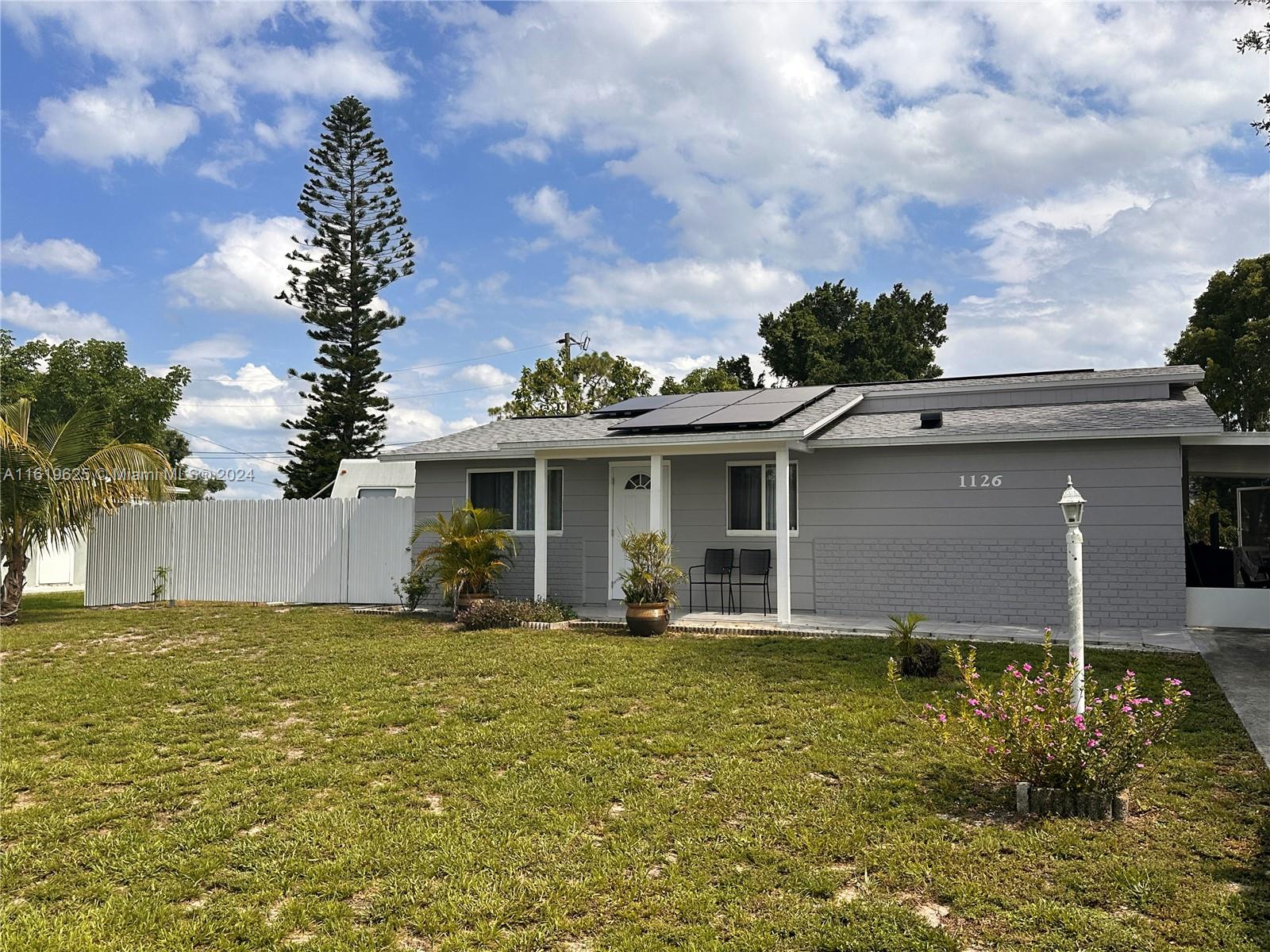 a view of a house with a yard