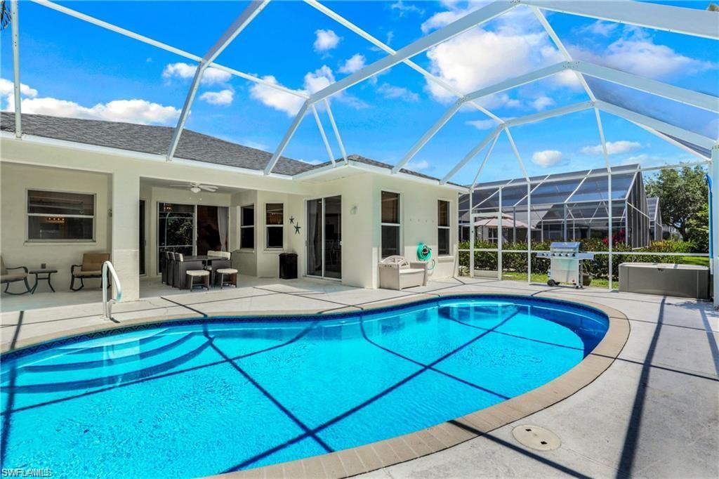 a view of a swimming pool with chairs