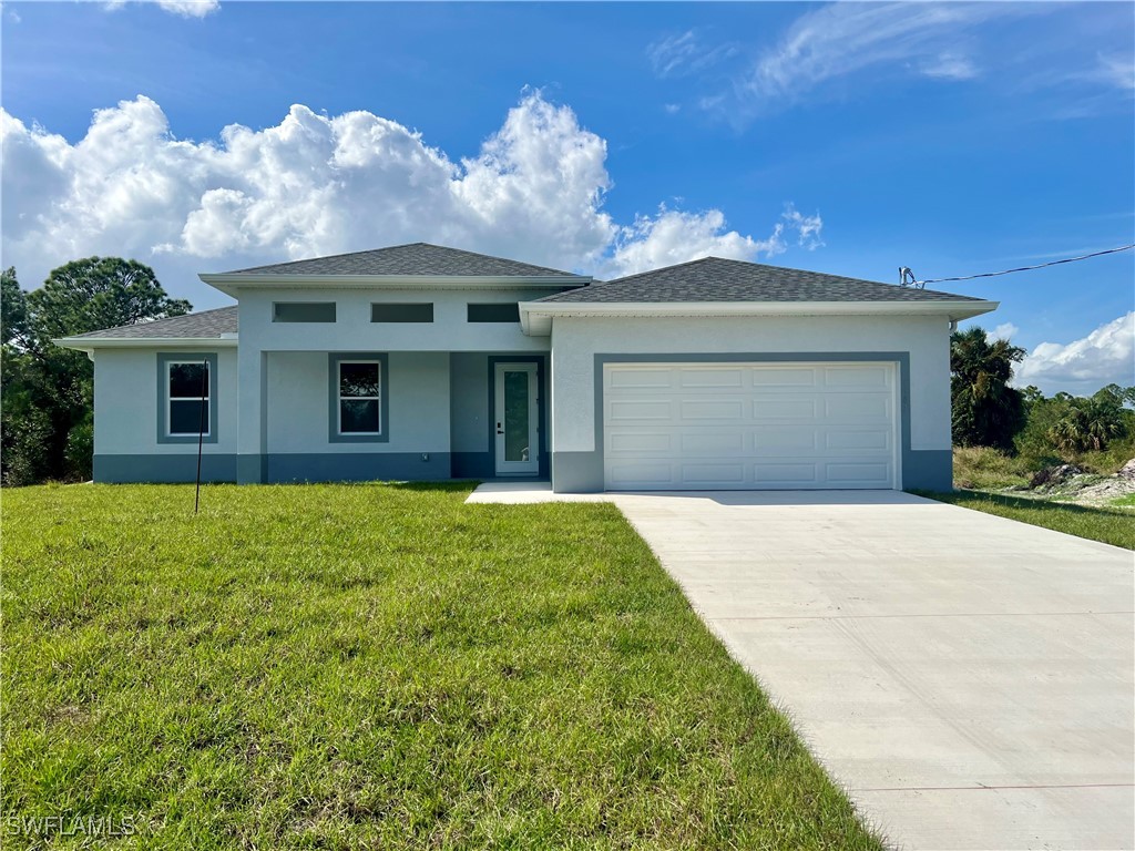 a front view of a house with yard