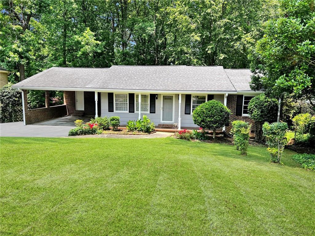 a front view of a house with garden