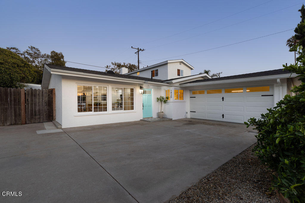 a front view of a house with a garage