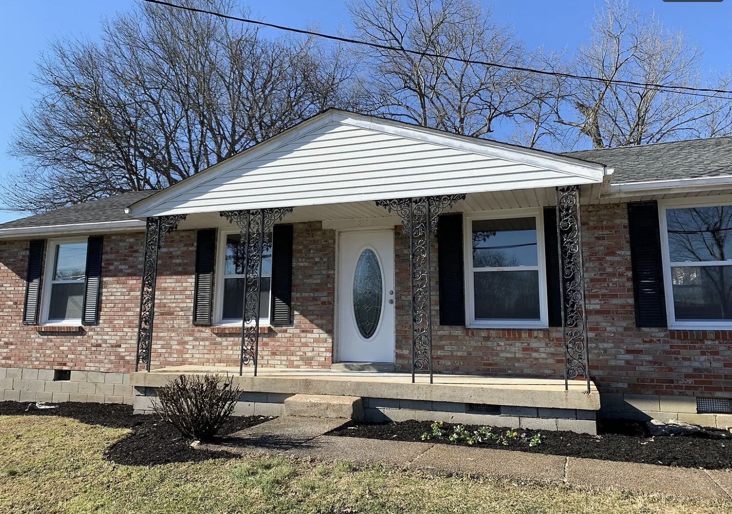 a front view of a house with yard