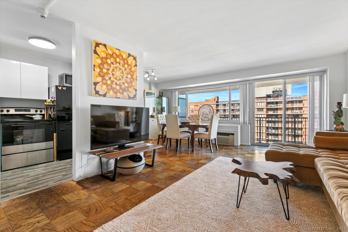 Spacious living room with sliders to balcony