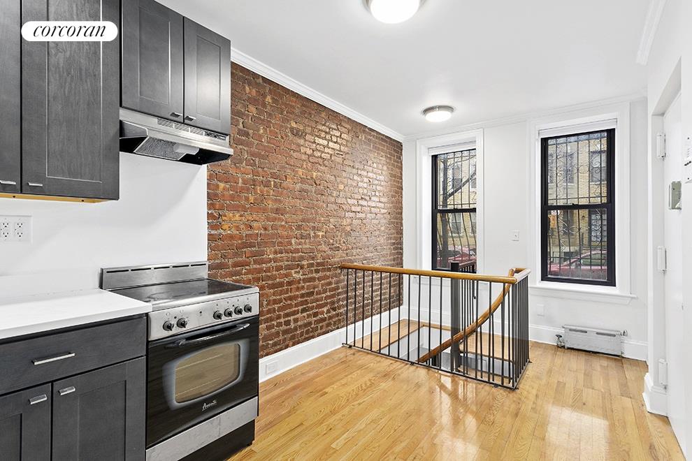 a kitchen with stainless steel appliances a stove a sink and a cabinets