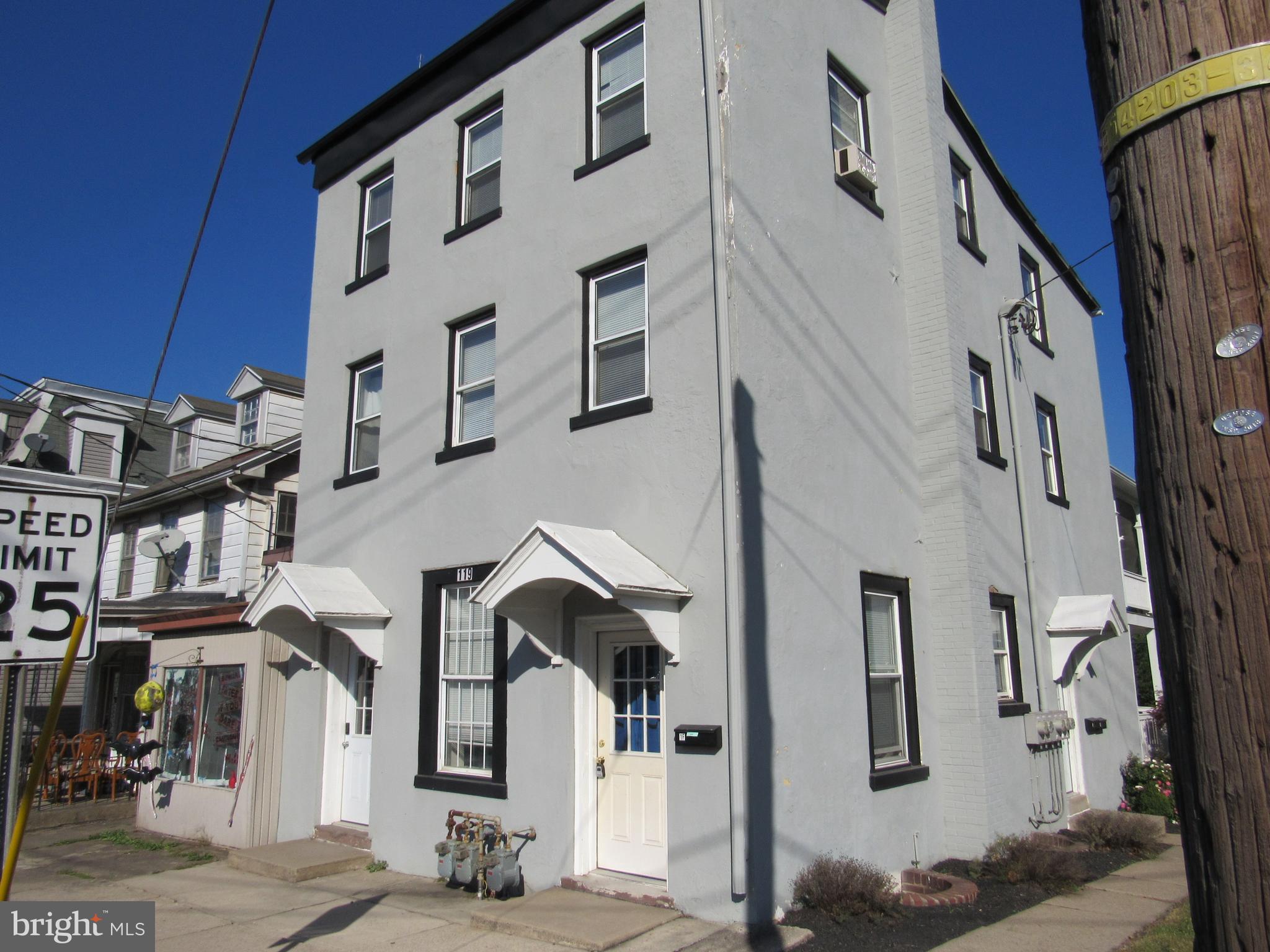 a front view of a building with many windows