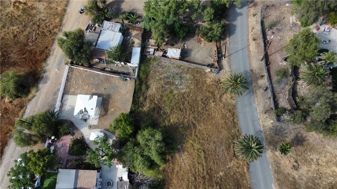 an aerial view of a house with a yard and garden