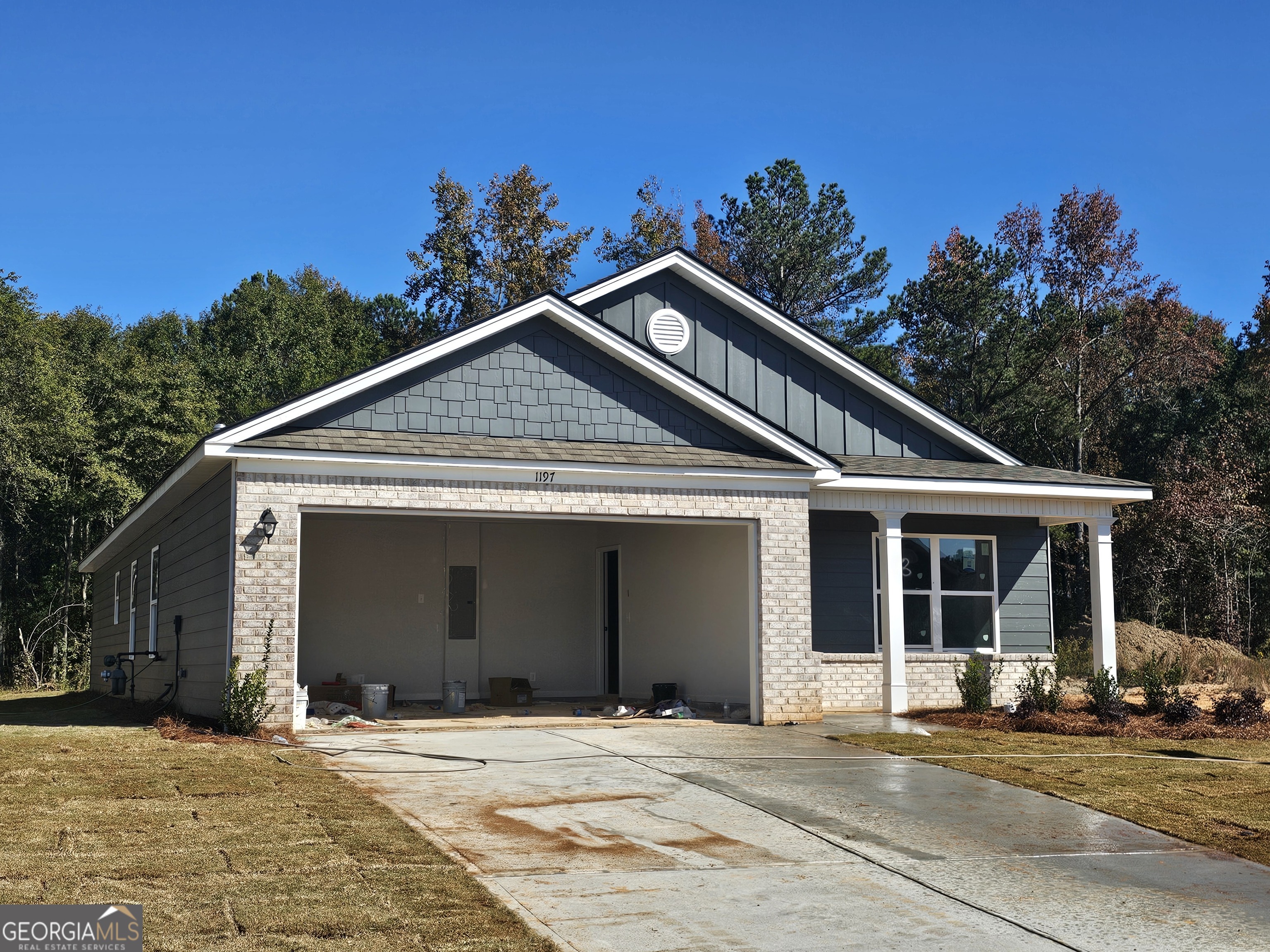 a front view of a house with a garage