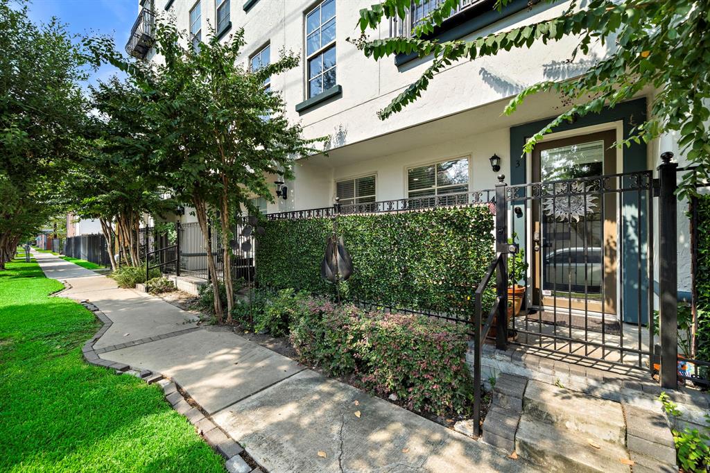 a view of a back yard of the house and a garden